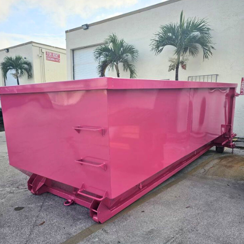A 15-yard roll-off dumpster on a construction site, used for medium-sized debris disposal.